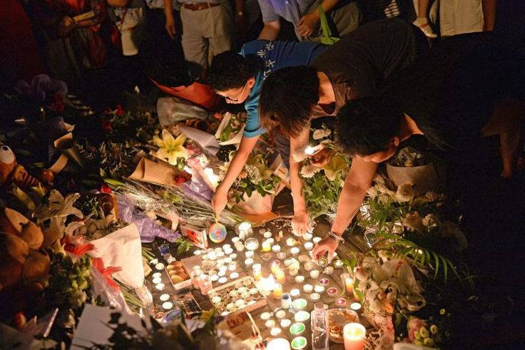 Mourners light candles during a vigil at the site of a knife attack which left two children dead in Shanghai in 2018. Attacks by society outcasts against children are not uncommon in China