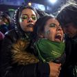 Activists in favor of abortion rights comfort each other outside the National Congress in Buenos Aires after senators rejected the bill to legalize the abortion in 2018