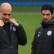 Manchester City manager Pep Guardiola (L) and his former assistant Mikel Arteta, who is the new Arsenal boss