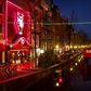 Amsterdam is looking at moving part of its famed red light district (pictured 2011) to an indoor complex that could include a bed and breakfast for prostitutes as well as a sex club, sex theatre and cafes