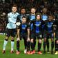 Club Brugge players posing before their Europa League game against Manchester United in February. They look set to be declared champions after the Belgian league agreed to declare the season finished due to the coronavirus pandemic
