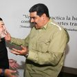 Venezuela's President Nicolas Maduro (R) has thanked Argentina's former football player Diego Armando Maradona for his support