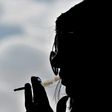 Saudi woman Heba smokes a cigarette at a cafe in Riyadh