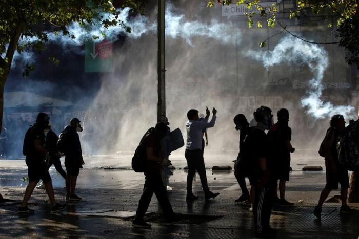 Police used water cannon and tear gas to disperse demonstrators in Chile's capital Santiago