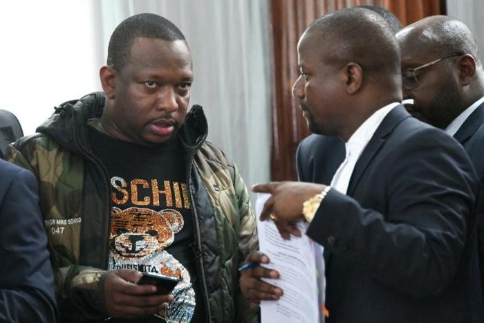 Nairobi Governor Mike Sonko, left, seen here in court in Nairobi on Monday, is known for his style mimicking an American rapper