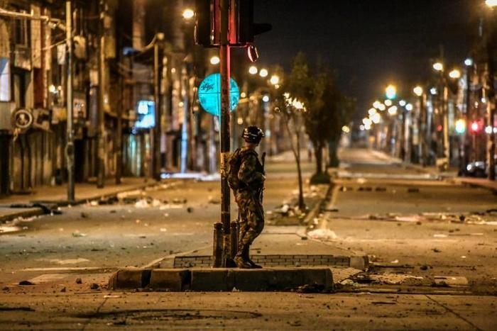 A Colombian army soldier guards a street on November 22, 2019 in Bogota, where protest leaders called a new general strike