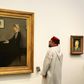 Moroccan King Mohammed VI looks at a painting titled "Whistler's Mother" by James Abbott McNeill Whistler (1871) at the November 2017 opening of Louvre Abu Dhabi Museum