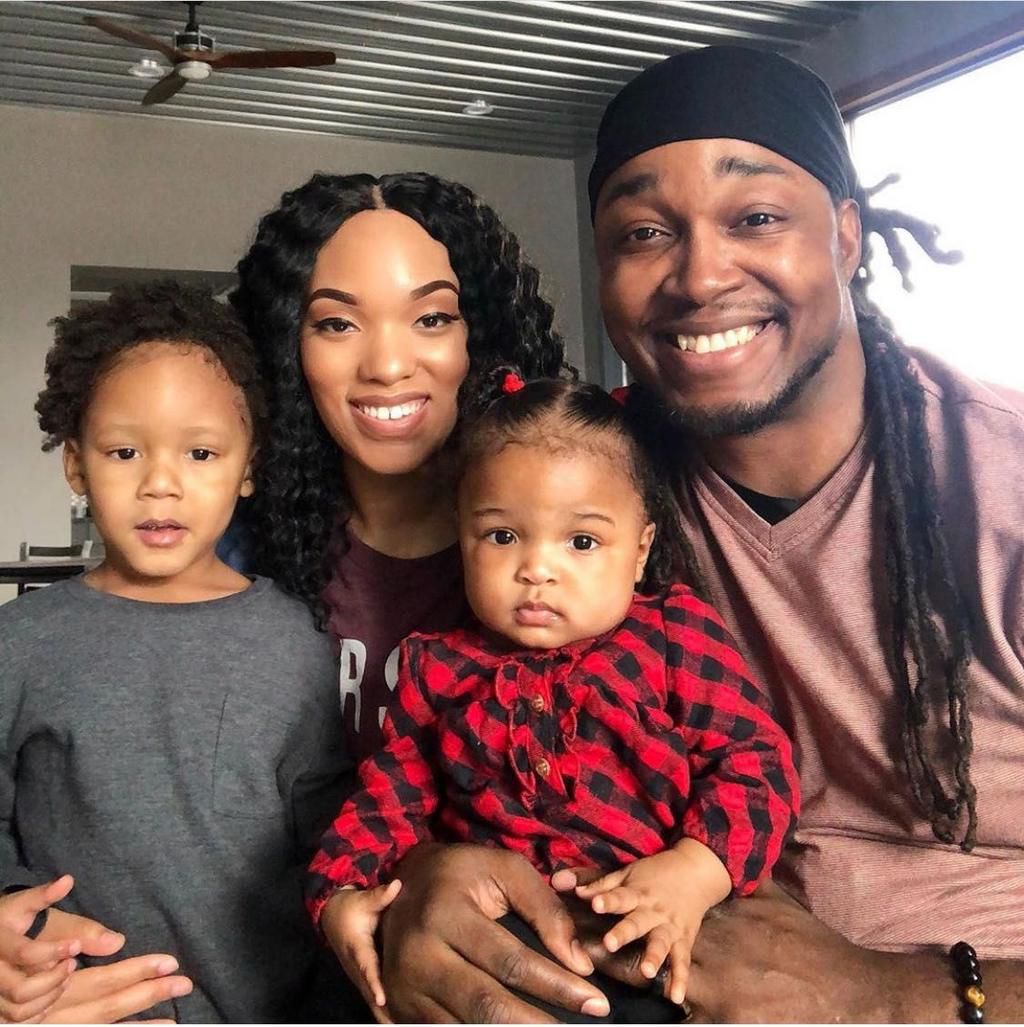Jasmine, her husband, and their two kids.