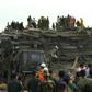 Hundreds of soldiers and rescuers frantically picked through the rubble of a collapsed building in southern Cambodia on Saturday looking for bodies as the death toll from the disaster rose to seven.