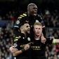 Kevin De Bruyne (right) celebrates his winning goal at the Bernabeu