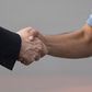 Mexican Foreign Minister Marcelo Ebrard (L) shakes hands with Bolivian ex-President Evo Morales upon his arrival in Mexico City, on November 12, 2019, where he was granted asylum after his resignation