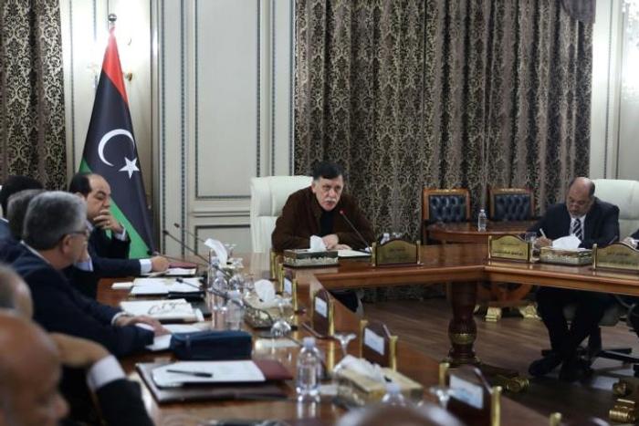 Libya's UN-recognised Prime Minister Fayez al-Sarraj (C) presided over a cabinet meeting where the implementation of a military deal with Turkey was 'unanimously approved'