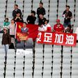 Chinese fans held a message of support for Wuhan during a women's Olympic football qualifier in Sydney