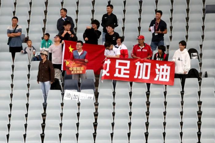 Chinese fans held a message of support for Wuhan during a women's Olympic football qualifier in Sydney
