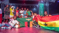 Lucky Sarpong (far right) holding a Ghana flag during the 2019 African Freestyle Football Championship