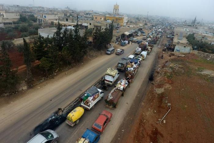 Fierce bombardment since mid-December has sparked a mass exodus from southern Idlib, as seen here in the village of Hazano on December 24