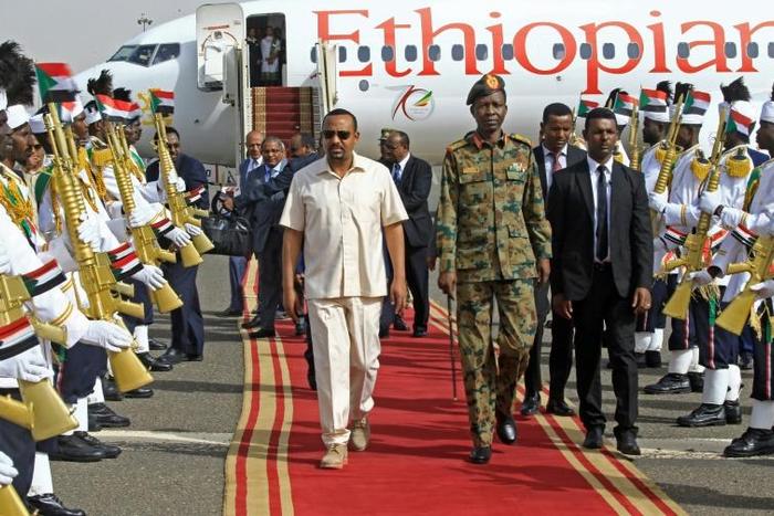 Ethiopia's Prime Minister Abiy Ahmed (C-L) will receive the Nobel Peace Prize at a crucial time for his country's transition