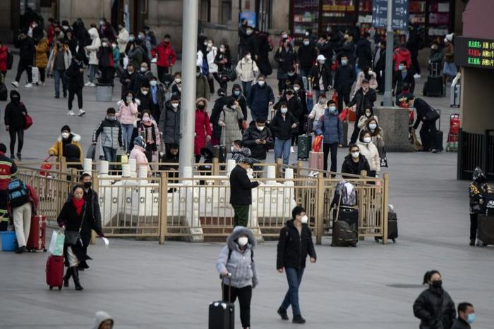 Neighbourhoods in China have ramped up checks on residents returning from virus-hit Hubei province