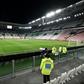A steward looks at the empty Juventus stadium before the Serie A match against Inter Milan behind closed doors on March 8, 2020.