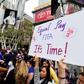 A US women's soccer fan displays a sign calling for equal pay at a rally to celebrate last year's US title run at the Women's World Cup