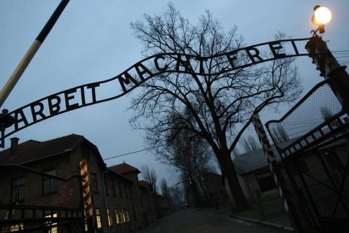 Merkel will walk through the infamous gate of the Auschwitz death camp