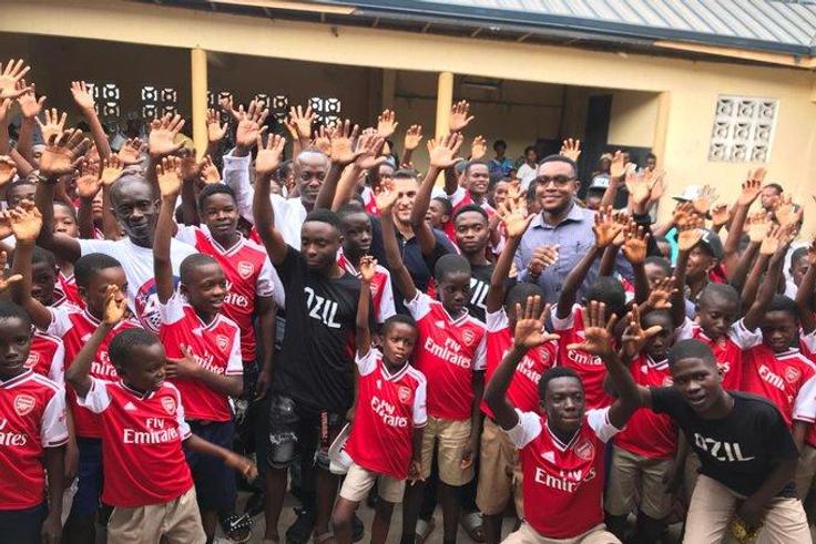 Arsenal’s Mesut Ozil reacts after discovering Ghanaian club is named after him