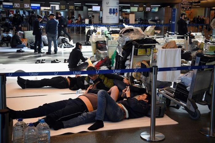 Travellers wait for flights to get back home at Moscow's Vnukovo airport