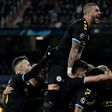 Manchester City's players celebrate their second goal against Real Madrid