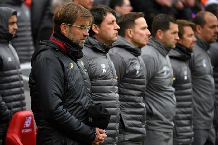 Liverpool manager Jurgen Klopp and his staff observe a minute's silence to mark 30 years since the Hillsborough disaster, in April 2019