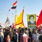 Demonstrators in Iraq's main southern city of Basra hold aloft a portrait of Shiite spiritual leader Grand Ayatollah Ali Sistani, who has increasingly backed their cause
