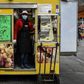Italians rely on delicacy stores like Gina's at the Porta Palazzo food market in Turin for comfort through the coronavirus emergency