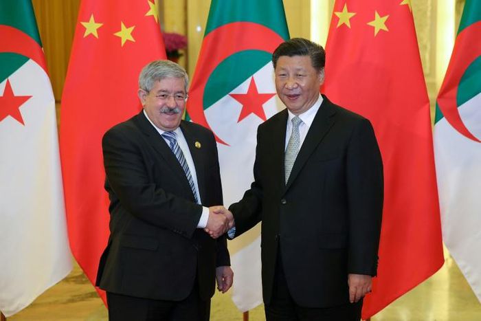 Chinese President Xi Jinping shakes hands with then Algerian prime minister Ahmed Ouyahia in Beijing in 2018