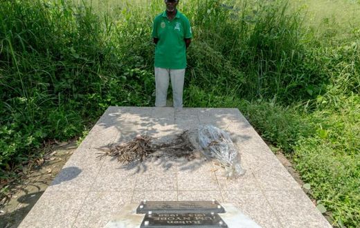 Louis Marie Mang, a UPC activist, stands before the tomb of anti-colonialist leader Ruben Um Nyobe