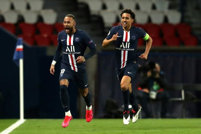 Neymar celebrates putting PSG ahead against Borussia Dortmund as captain Marquinhos gives chase
