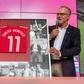 Uli Hoeness (L) receives a framed Bayern Munich shirt from club chairman Karl-Heinz Rummenigge, after revealing he is standing down as club president