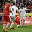 Serge Gnabry (C) scored two goals in Bayern Munich's 4-1 win at Cologne which left the defending champions a point clear at the top of the Bundesliga on Sunday.