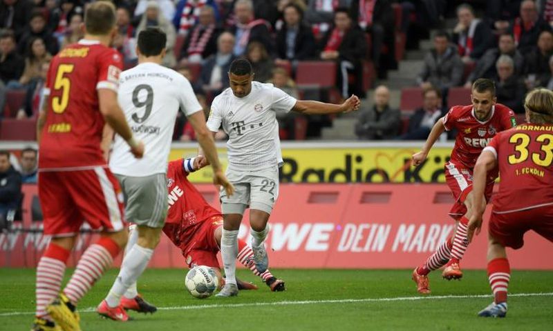 Serge Gnabry (C) scored two goals in Bayern Munich's 4-1 win at Cologne which left the defending champions a point clear at the top of the Bundesliga on Sunday.
