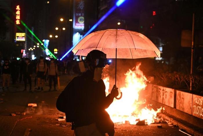 Around 100 protesters remain barricaded inside the Hong Kong campus surrounded by riot police