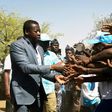 Press the flesh: President Faure Gnassingbe on the campaign trail in northern Togo. His family has been in power for more than half a century