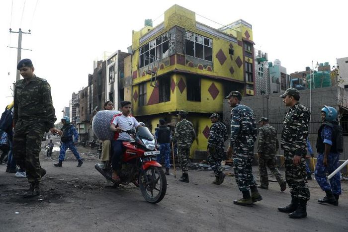 Indian police patrol a riot-affected area in New Delhi