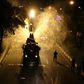 Iranian firefighters disinfect the streets of south Tehran in a bid to stem the spread of the coronavirus as the death toll heads on upwards