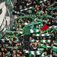 Supporters of Raja Club Athletic chant slogans and wave flags at a Moroccan football match between Raja and Mouloudia Oujda in January