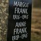 A memorial stone for the young diarist Anne Frank and her sister on the grounds of the former concentration camp Bergen-Belsen