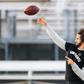 Colin Kaepernick makes a pass during a Saturday workout after ditching an NFL-planned private training session for his own public workout at a nearby high school field