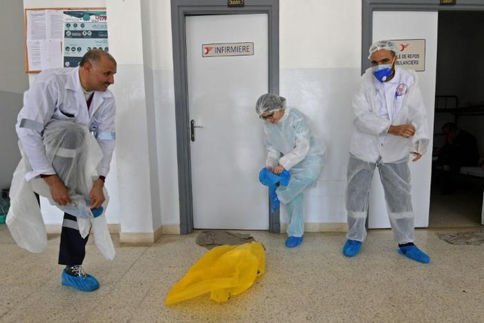 Tunisia's emergency medical care doctors (pictured April 6, 2020) dress in personal protective equipment as a measure of protection against the coronvirus, before heading out to treat a COVID-19 patient in the capital Tunis