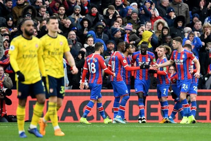 Crystal Palace forward Jordan Ayew celebrates with teammates after scoring the equaliser against Arsenal in their Premier League match at Selhurst Park
