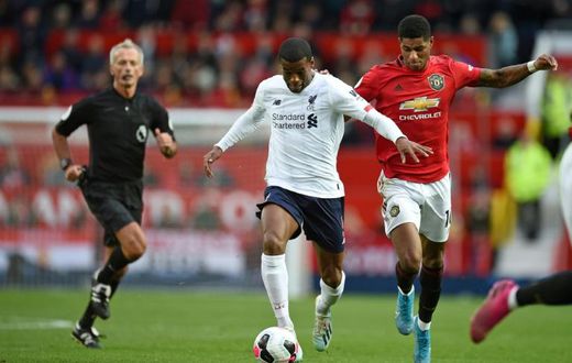 Left behind: Liverpool are 27 points ahead of Manchester United