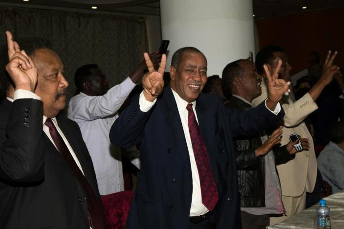 Delegation members of Sudan's transitional government react after two-week long peace talks with rebels in Juba in October