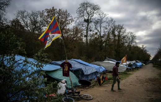 The makeshift camp set up by Tibetan asylum seekers near a  forest in Acheres, northwest of Paris.