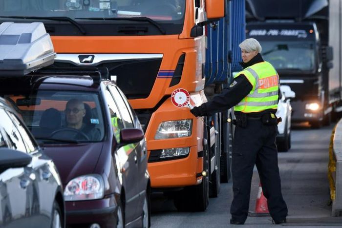 Motorists were forced to wait up to an hour, with police under orders to turn back any drivers without a 'particular reason' to cross